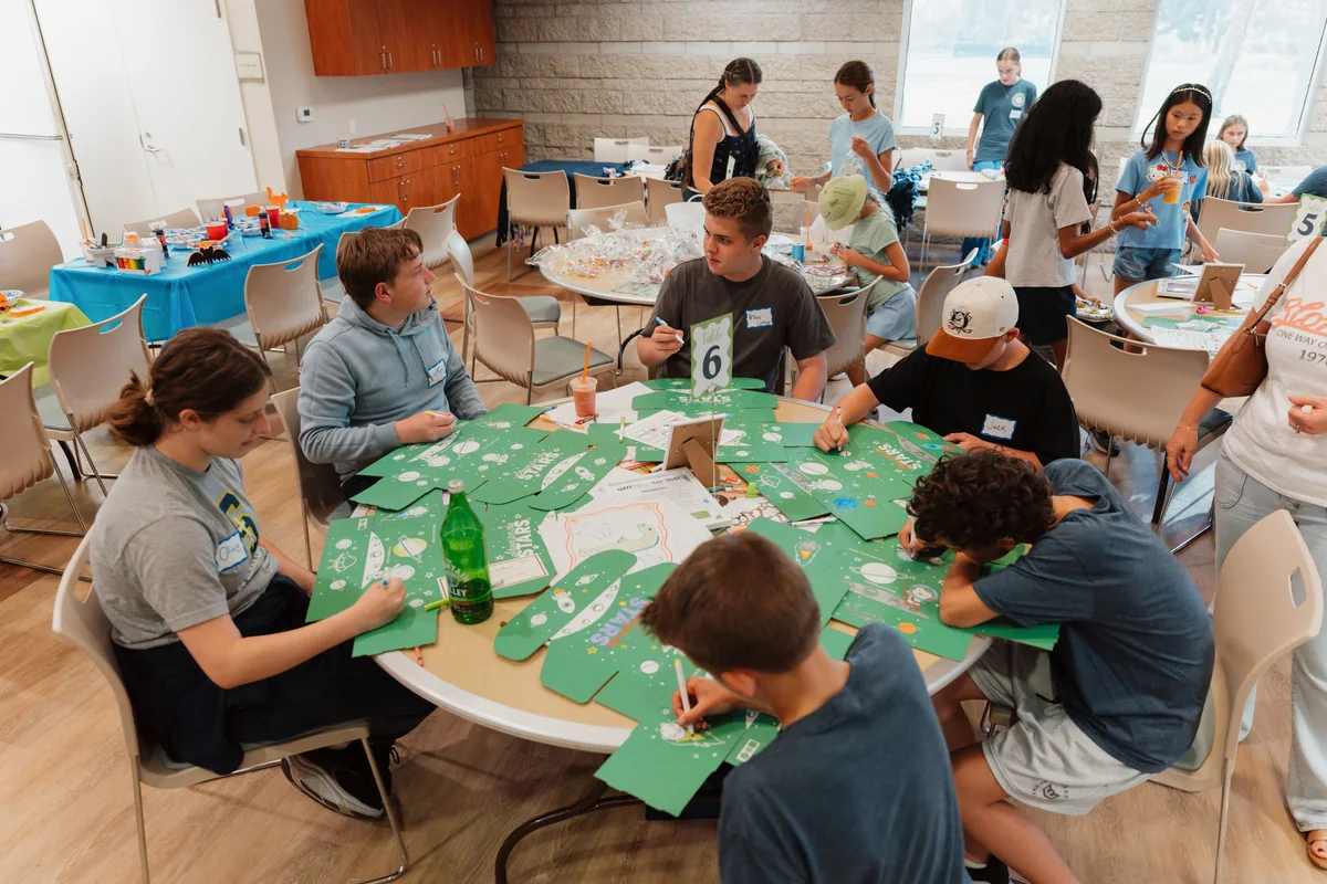 Lion’s Heart teen volunteers enthusiastically participating in a community partner service project. Photo by Nathan Palmer / OC Marketing Media